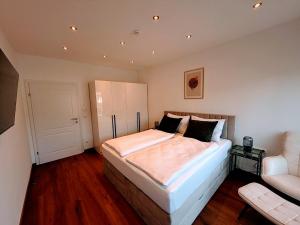 Ένα ή περισσότερα κρεβάτια σε δωμάτιο στο Ferienappartements DeLux Keutschach am See +20 φωτογραφίες