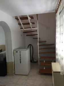 a room with a staircase and a refrigerator next to a room at Holiday home in Gyenesdias - Balaton 18816 in Gyenesdiás +31 photos