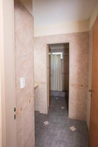an empty hallway with a shower in a room at Quinta La Soñada in Etchegoyen