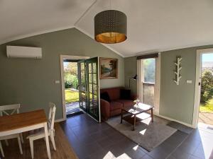 a living room with a couch and a table at Burra Hills in Burra
