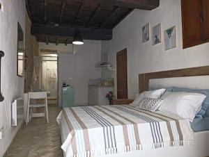 Postel nebo postele na pokoji v ubytování Cami Suite - monolocale a Spoleto