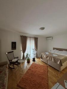 Postel nebo postele na pokoji v ubytování Apartmani IDILA