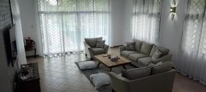 a living room with two couches and a coffee table at Imani holiday homes in Mtwapa