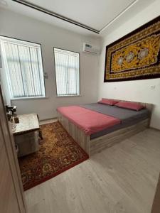 Ένα ή περισσότερα κρεβάτια σε δωμάτιο στο KAMIR Guest House