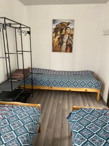 Postel nebo postele na pokoji v ubytování Guesthouse Snow Leopard - 'Ak Ilbirs'