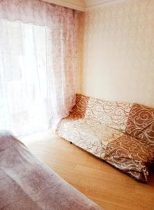 a bed sitting in a room with a window at 2кімнатна Центр поруч з Мечнікова in Dnipro