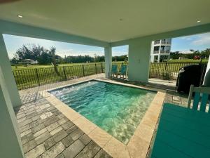 a swimming pool in the middle of a yard at Baydream Believer at Hunter's Point in Cortez