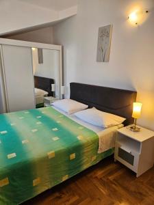 a bedroom with a large bed and a mirror at Apartment Mary in Trogir +112 photos