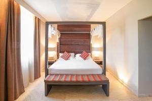 A bed or beds in a room at Tenuta San Masseo - boutique farm resort & SPA