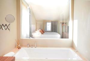 A bed or beds in a room at Tenuta San Masseo - boutique farm resort & SPA