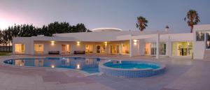 a house with a swimming pool in front of it at Villa Portugal in Palmela