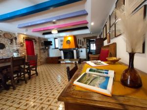 a living room with a table and a dining room at Casale Civetta in Senigallia +31 photos