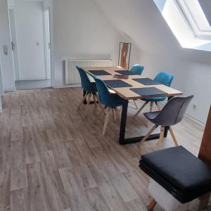 a conference room with a table and chairs in it at Ferienwohnung zur Schmiede in Prödel
