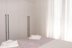 Postel nebo postele na pokoji v ubytování Konzul apartment + 66 fotografií