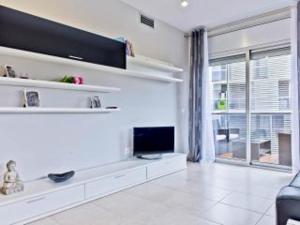 A television and/or entertainment center at Apartment Paradise Salou