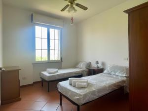 a room with two twin beds and a window at Paradise Palace Apartment 2 in Pula
