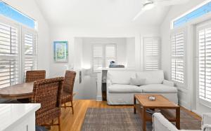 a living room with a couch and a table at Spice in Santa Rosa Beach