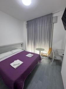Postel nebo postele na pokoji v ubytování Hotel MDP