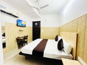 Postel nebo postele na pokoji v ubytování Hotel Vasundhara Grand - Vasundhara