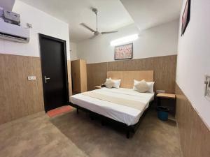 Postel nebo postele na pokoji v ubytování Hotel Vasundhara Grand - Vasundhara