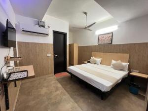 Postel nebo postele na pokoji v ubytování Hotel Vasundhara Grand - Vasundhara