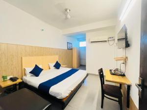 Postel nebo postele na pokoji v ubytování Hotel Vasundhara Grand - Vasundhara
