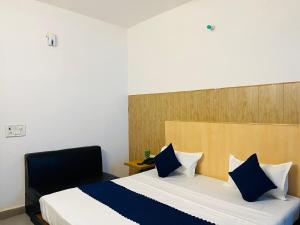 Postel nebo postele na pokoji v ubytování Hotel Vasundhara Grand - Vasundhara