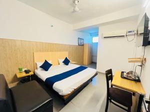 Postel nebo postele na pokoji v ubytování Hotel Vasundhara Grand - Vasundhara