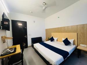 Postel nebo postele na pokoji v ubytování Hotel Vasundhara Grand - Vasundhara