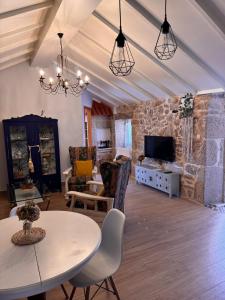 TV a/nebo společenská místnost v ubytování Casa A Barcia