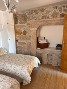 Postel nebo postele na pokoji v ubytování Casa A Barcia + 10 fotografií