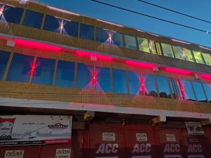 a building with red lights on the side of it at Hotel The Kargil Castle in Kargil +15 photos