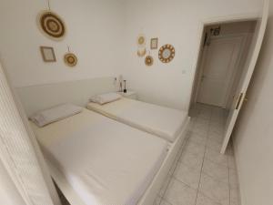 Ein Bett oder Betten in einem Zimmer der Unterkunft Cozy Sun