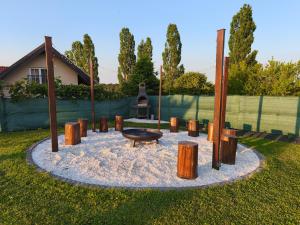 a fire pit in the middle of a yard at Guesthouse and Wellness VINEA in Spodnji Ivanjci