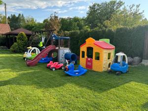 a group of childrens play equipment on the grass at Pokoje Irys in Kazimierz Dolny
