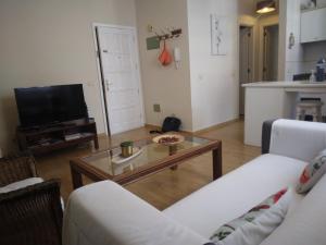 Telewizja i/lub zestaw kina domowego w obiekcie Apartamento Ossuna