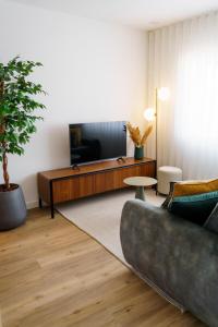 Televisyen dan/atau pusat hiburan di Lighthouse by MyMoradia I Vue & Élégance à Porto