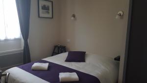 Llit o llits en una habitació de Hotel Belvue