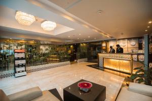a lobby of a store with a table and a counter at Ethnotel, Kolkata Airport in Kolkata