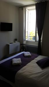 Llit o llits en una habitació de Hotel Belvue
