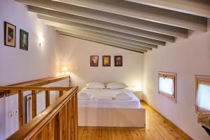 a bedroom with a bed in a room at D BERNARDAKI Garden House in Mytilene