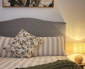 a bedroom with a bed with a pillow on it at Eliza's Place - CWA Coonamble in Coonamble
