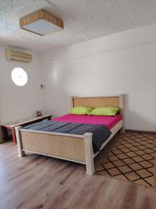 a bedroom with a large bed in a room at VerZion Kréol in Pointe aux Piments +10 photos
