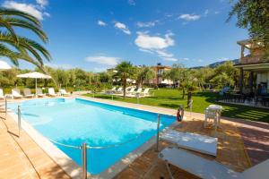 a swimming pool in a house with a yard at Chrisa Hotel in Limenas