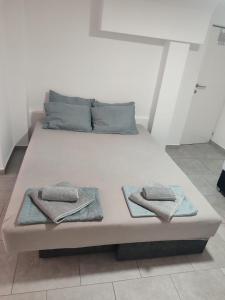 Postel nebo postele na pokoji v ubytování Apartmani Hub