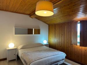 Ένα ή περισσότερα κρεβάτια σε δωμάτιο στο Azores Pedra Apartaments H