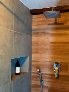 a bottle of wine sitting on a shelf in a bathroom at Apartman Thermea in Krapinske Toplice +36 photos