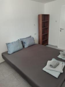Postel nebo postele na pokoji v ubytování Apartmani Hub