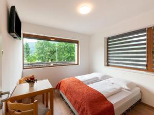 Ένα ή περισσότερα κρεβάτια σε δωμάτιο στο Property in Kirchbichl