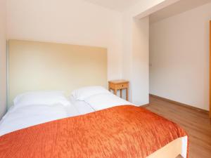 Ένα ή περισσότερα κρεβάτια σε δωμάτιο στο Property in Kirchbichl